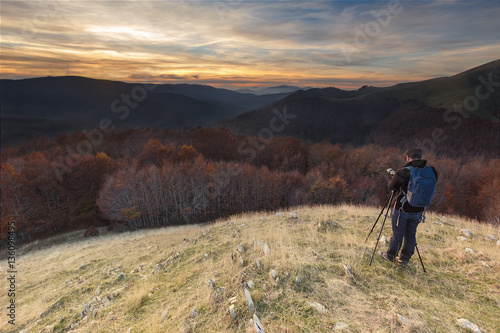 Photographer over Irati forest at sunset