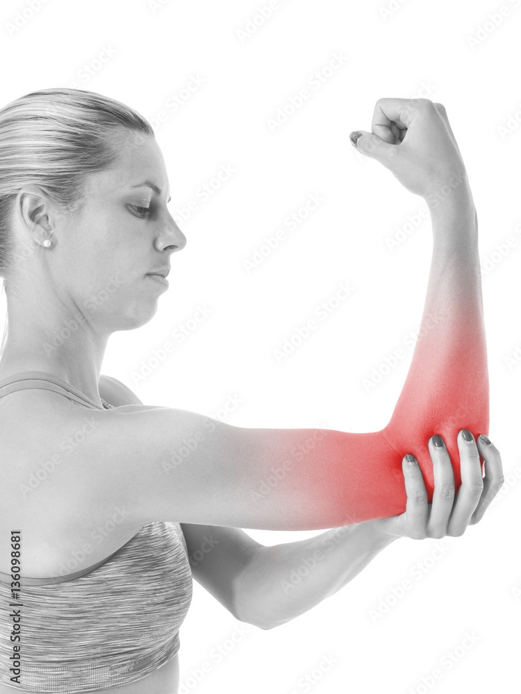 Acute pain in a woman elbow. Female holding hand to spot of elbo Acute pain in a woman elbow. Female holding hand to spot of elbo