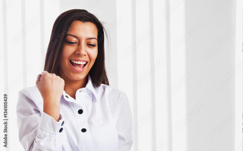 Portrait of a very happy business woman celebrating good news Portrait of a very happy business woman celebrating good news