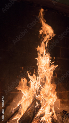 Burning fireplace. Vintage background.