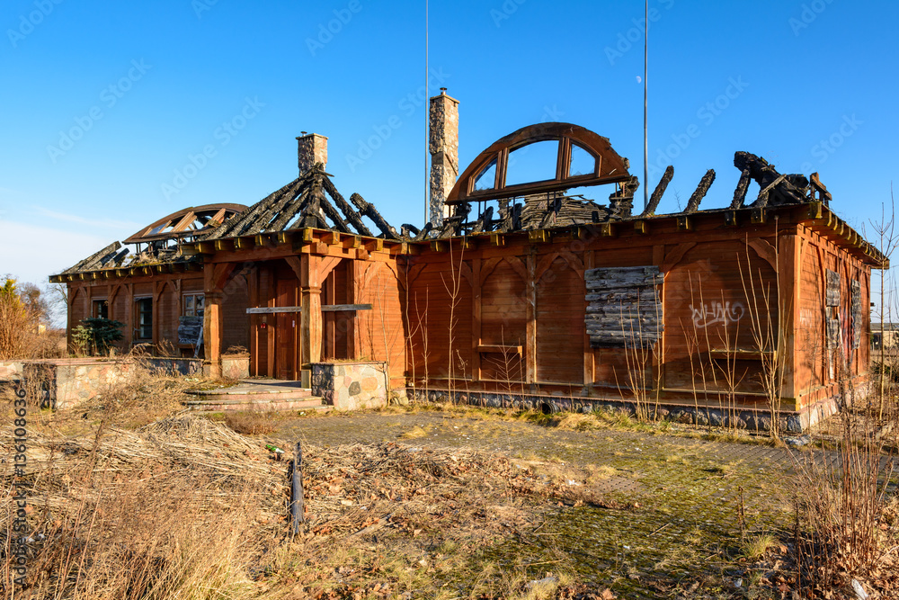 Abandoned wooden house destroyed by fire. 