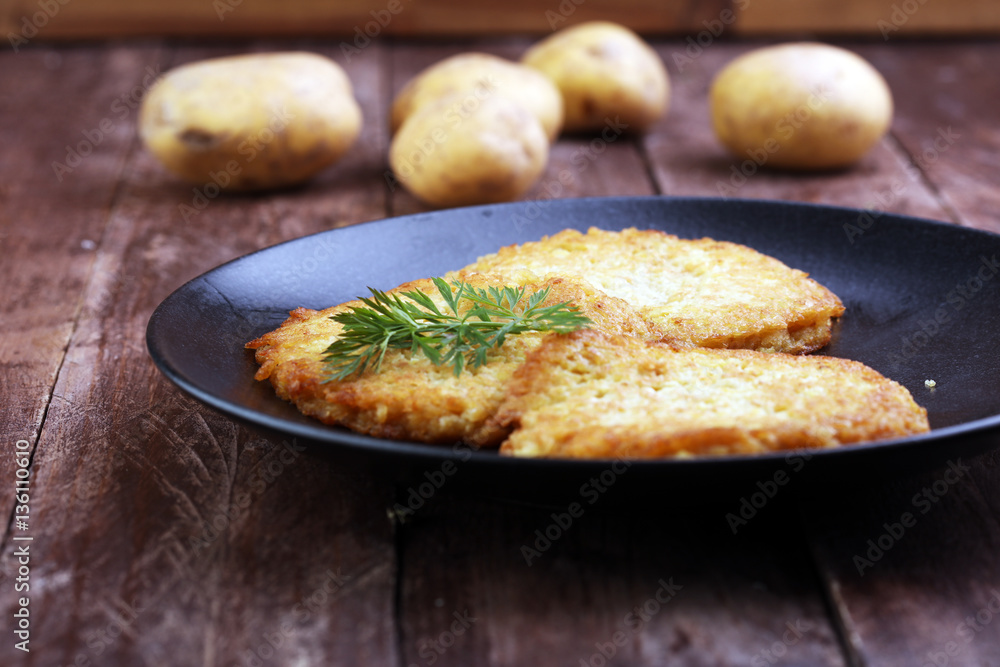 Potato Pancake on a wooden table Potato Pancake on a wooden table