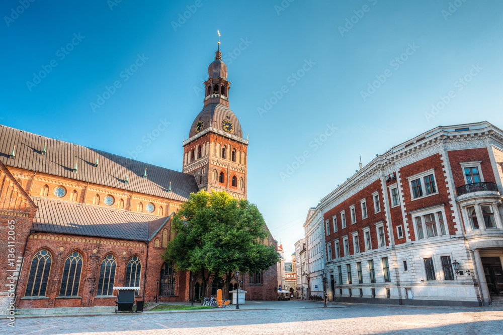 Riga, Latvia. Dome Cathedral In Sunny Evening Light Under Blue Sky
