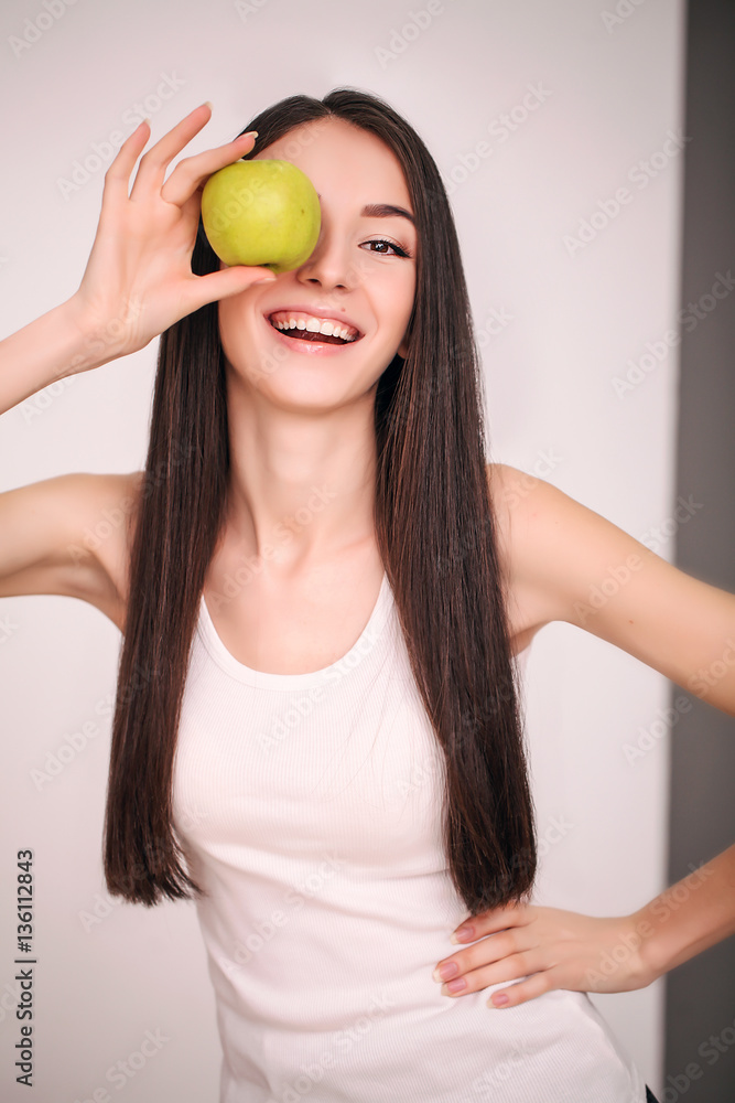 Diet. The young beautiful girl who cares for her figure, making healthy food choices, fresh fruit. The concept of healthy eating Diet. The young beautiful girl who cares for her figure, making healthy food choices, fresh fruit. The concept of healthy eating