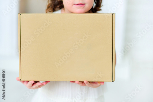 Box in the hands of a child