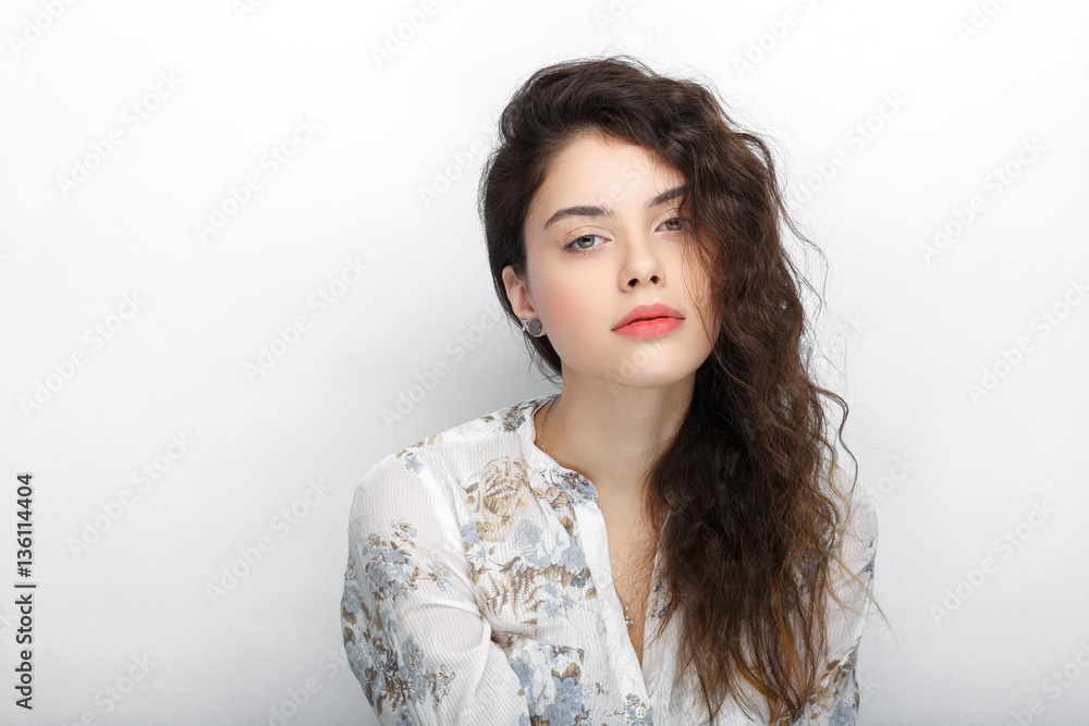 Beauty portrait of young adorable fresh looking brunette woman with long brown healthy curly hair. Emotion and facial expression lifestyle concept. Beauty portrait of young adorable fresh looking brunette woman with long brown healthy curly hair. Emotion and facial expression lifestyle concept.