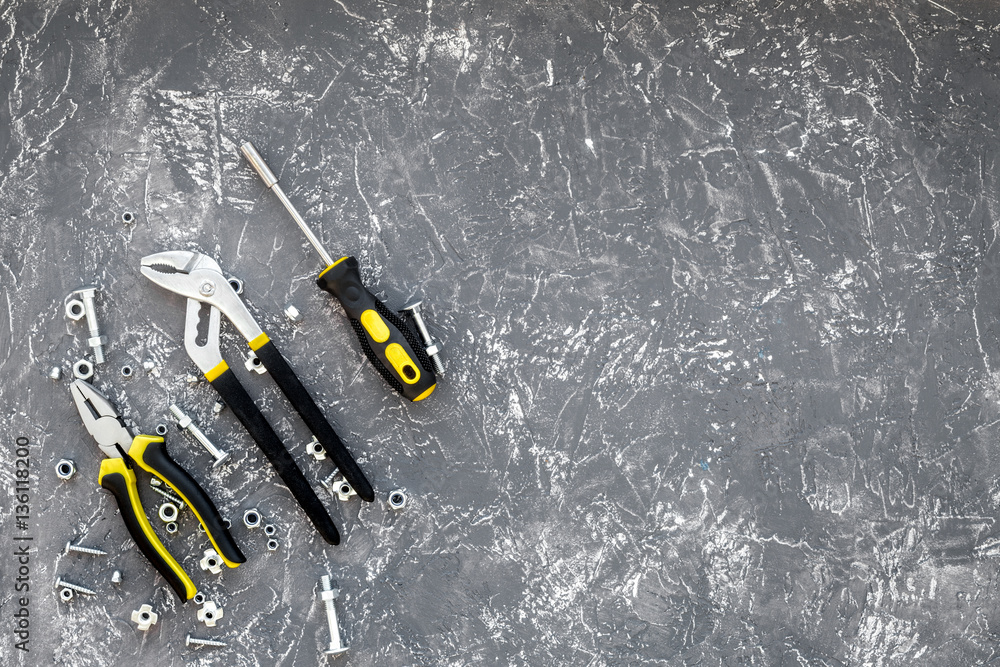 Tools for repairing top view on stone background Tools for repairing top view on stone background