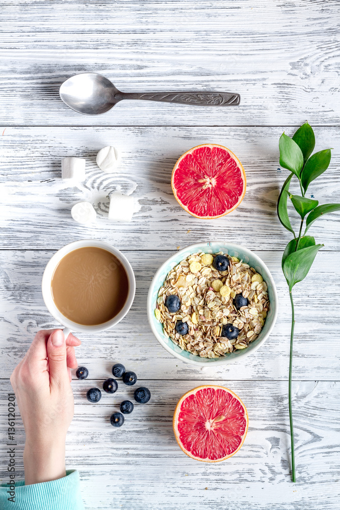 Breakfast concept with flowers on wooden background top view Breakfast concept with flowers on wooden background top view