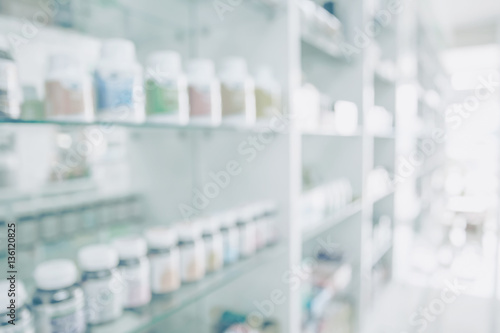 Pharmacy blurred light tone with store drugs shelves interior background, Concept of pharmacist and chemist. photo
