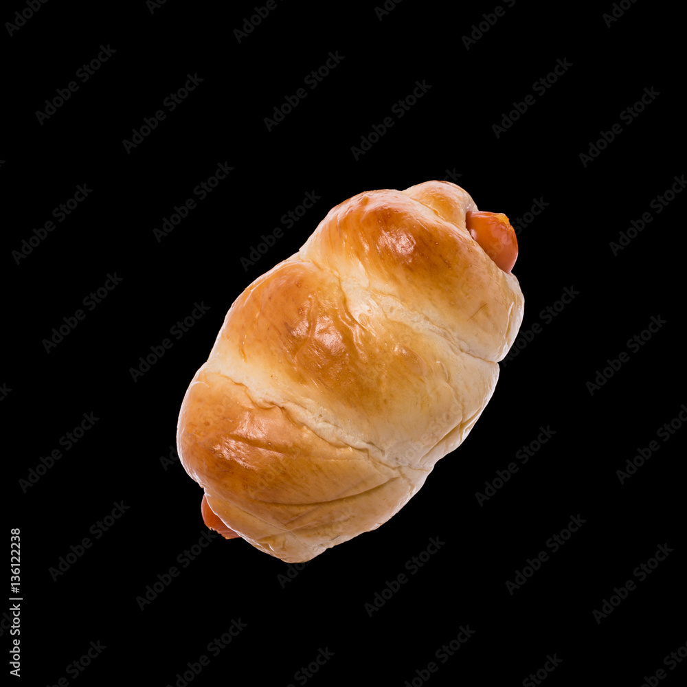 Bread with Sausage. Studio shot isolated on black Bread with Sausage. Studio shot isolated on black