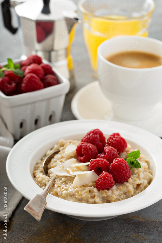 Steel cut oatmeal porridge with raspberry and coconut