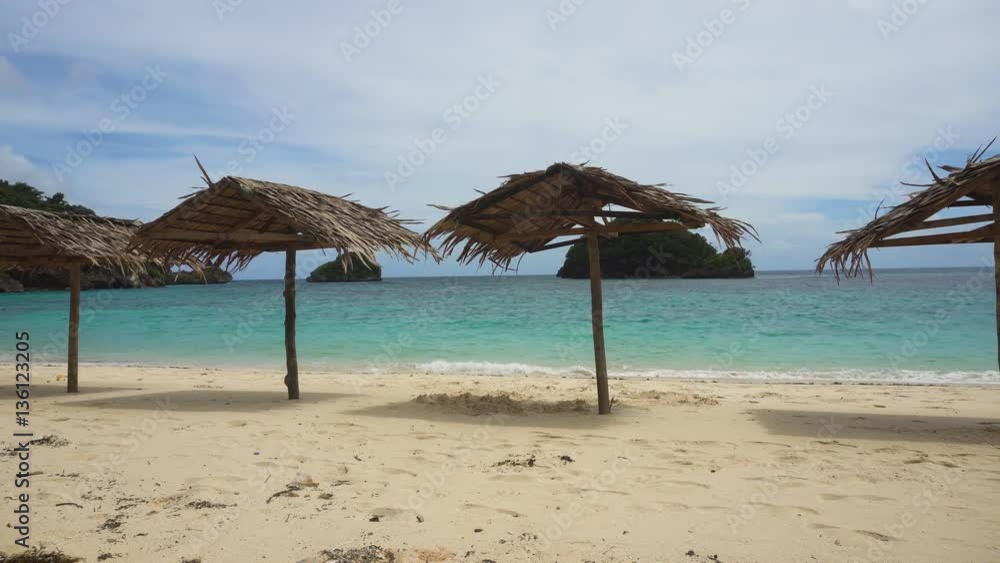 Beach with deck chairs, sun beds, umbrellas.Beach, sea, sand,wave. Seascape ocean and beautiful beach paradise, blue sky, clouds. Philippines 4K video Travel concept Beach with deck chairs, sun beds, umbrellas.Beach, sea, sand,wave. Seascape ocean and beautiful beach paradise, blue sky, clouds. Philippines 4K video Travel concept