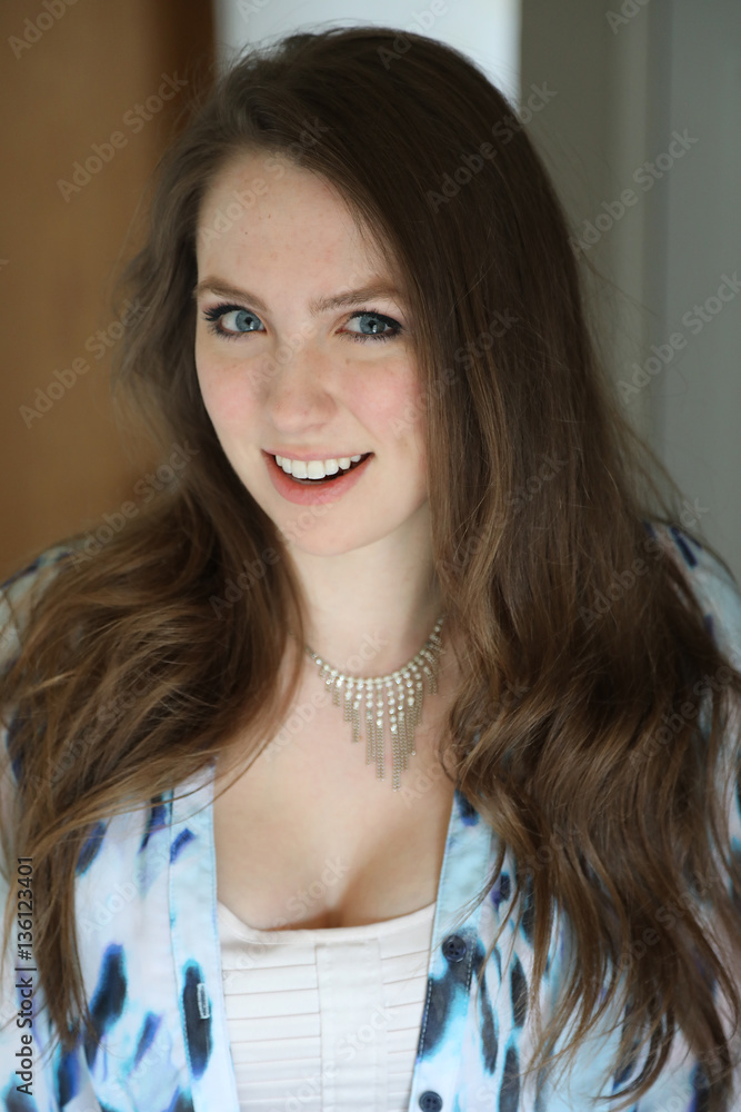 Woman with Brown Hair and Beautiful Blue Eyes