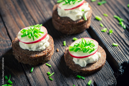 Diet sandwich with pumpernickel bread, cottage cheese and chive photo