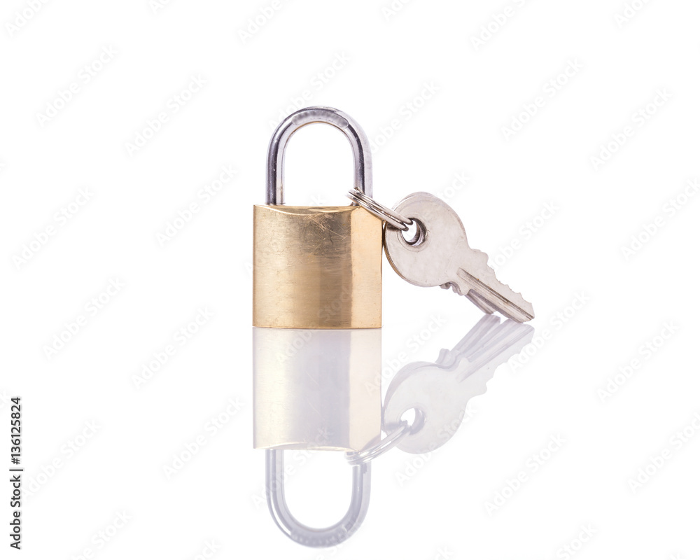 New lock with key. Studio shot isolated on white New lock with key. Studio shot isolated on white