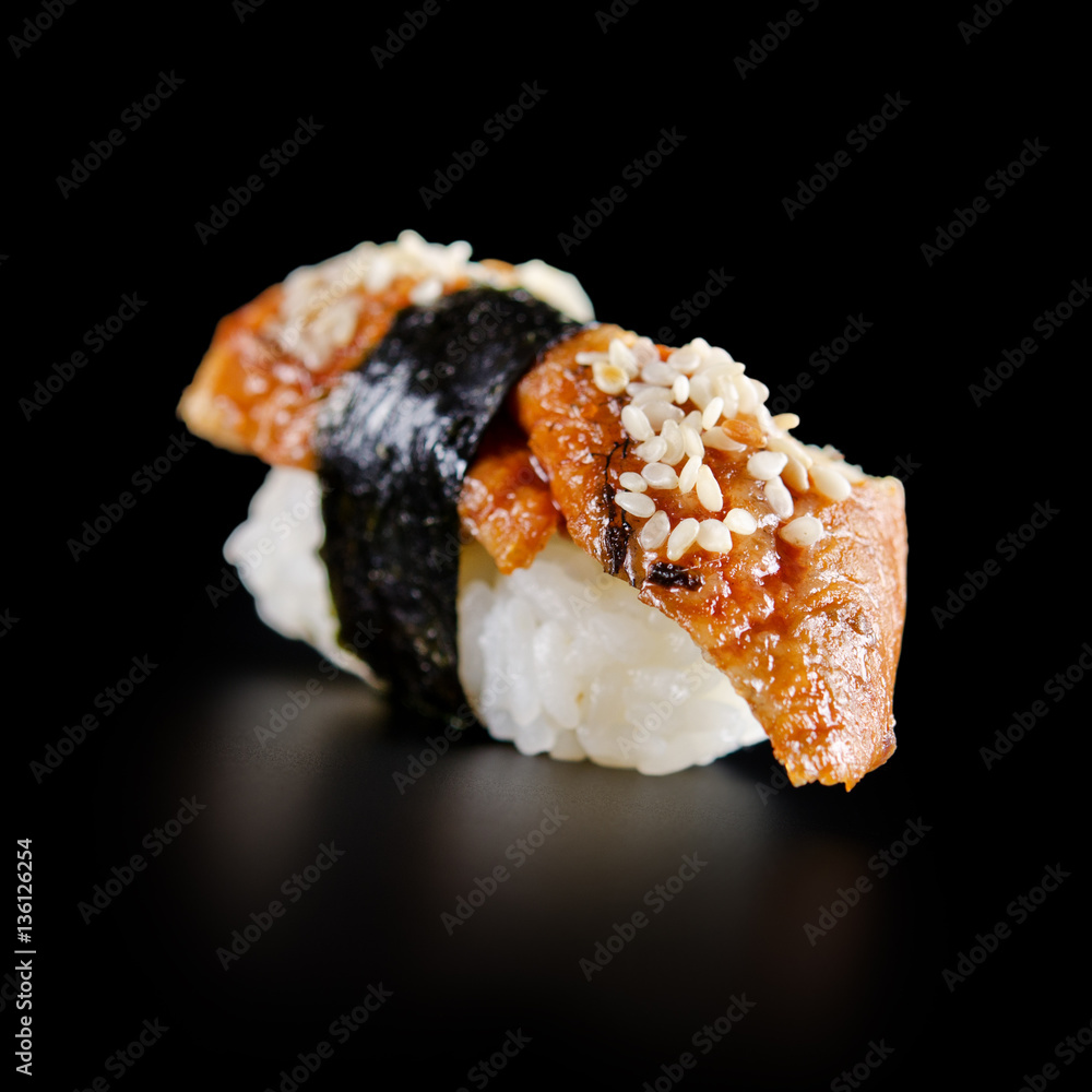 traditional fresh japanese sushi rolls on a black background traditional fresh japanese sushi rolls on a black background