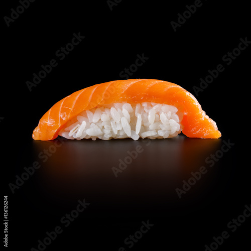 traditional fresh japanese sushi rolls on a black background