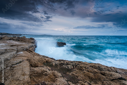 Waves crasching at cliffs at Mediterranean Sea in Spain