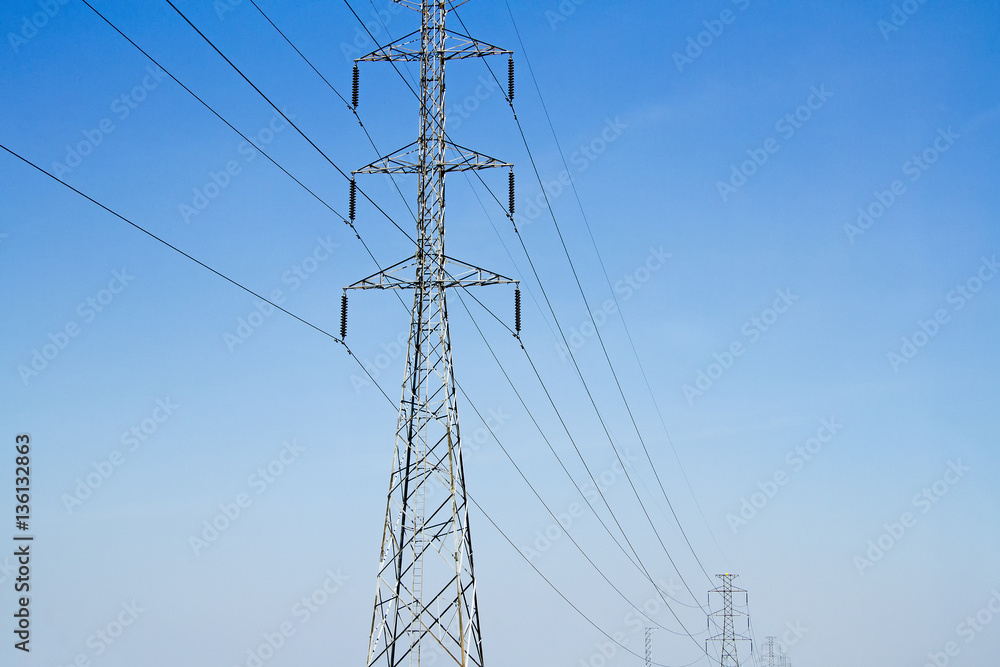 High voltage electric pole with blue sky and engineering backgro