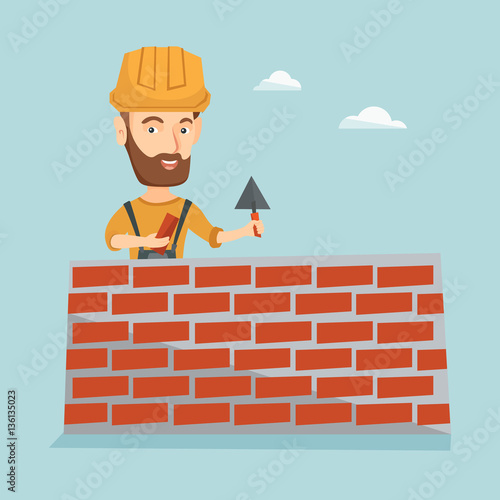 Bricklayer working with spatula and brick.