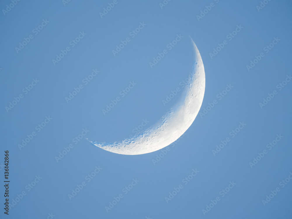 Crescent moon in the morning with clear blue sky Crescent moon in the morning with clear blue sky