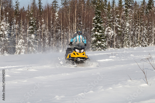 Athlete on a snowmobile.