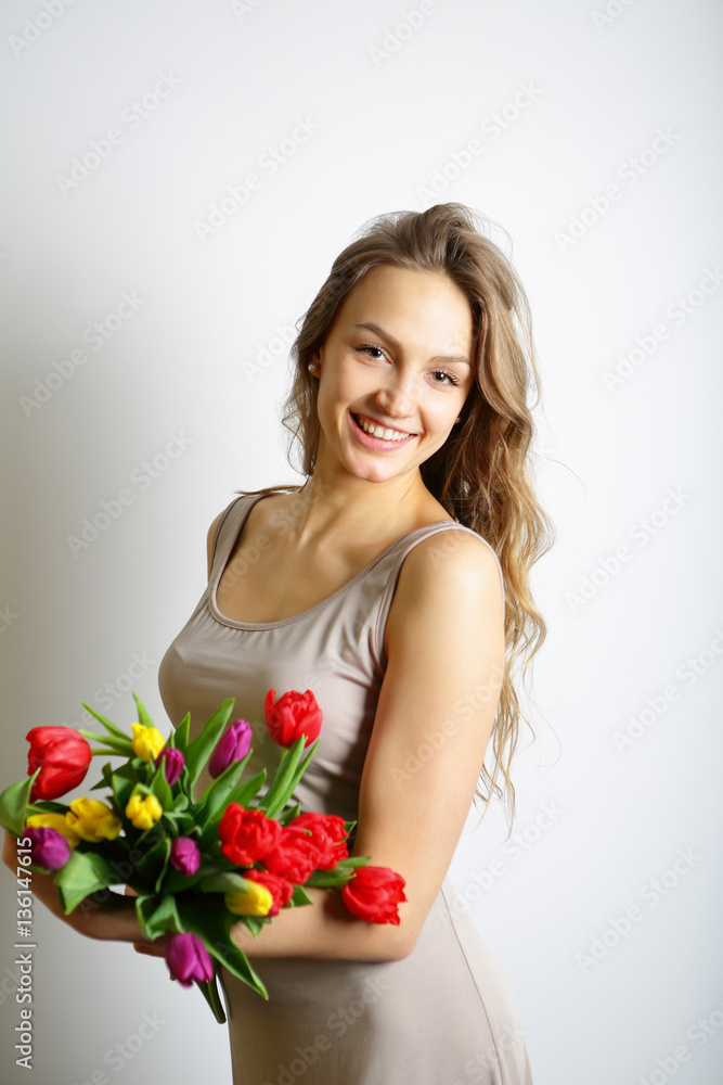 Happy girl with spring bright flowers in her hands. Concept 8 Ma Happy girl with spring bright flowers in her hands. Concept 8 Ma