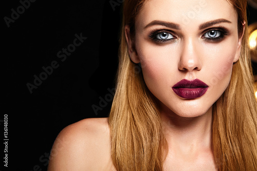 sensual glamour portrait of beautiful woman model with fresh daily makeup with dark red lips color and clean healthy skin face