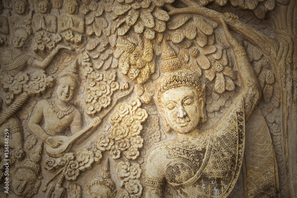 Low-relief image of beautiful woman in the north of temple of Thailand, no copyright