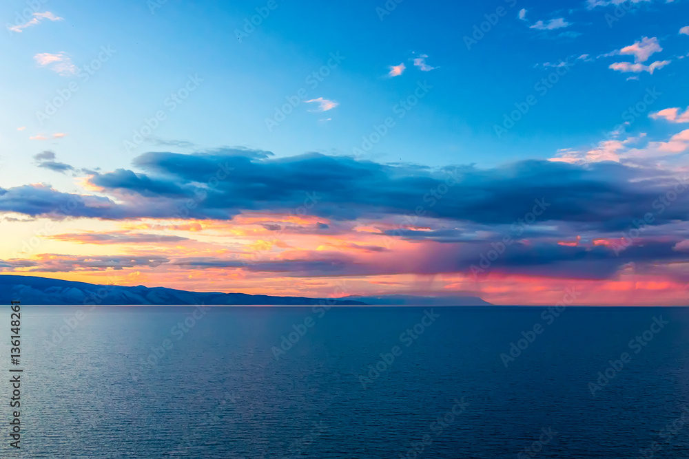 Sunset over a mountain ridge at Lake Baikal Sunset over a mountain ridge at Lake Baikal