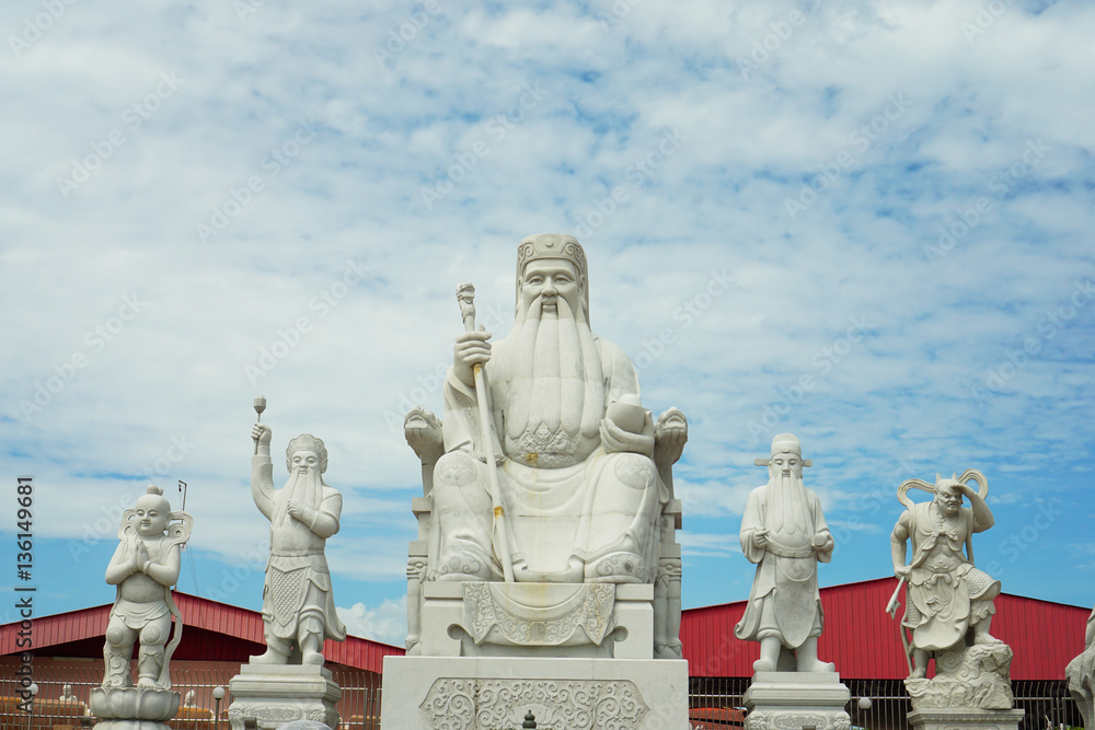 Chinese god statues in Chinese temple,Perak Malaysia with blue sky background Chinese god statues in Chinese temple,Perak Malaysia with blue sky background