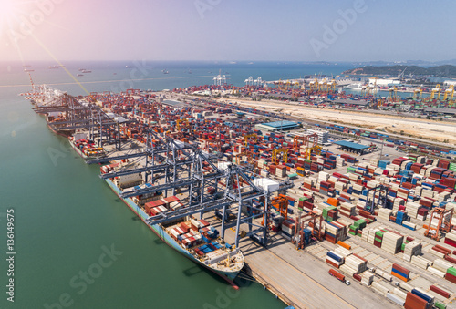 The busy of port congestion loading and discharging  containers services in maritime transports in World wide logistics photo