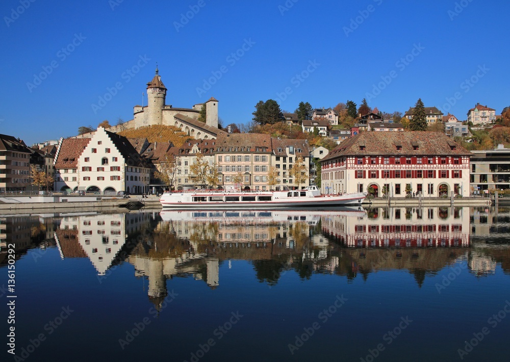 Medieval castle Munot and old houses reflecting in the river Rhine