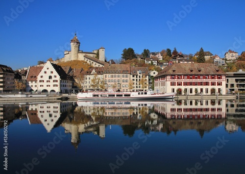 Medieval castle Munot and old houses reflecting in the river Rhine