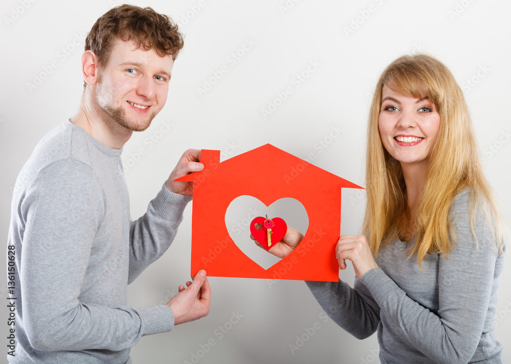 Positive couple with heart house. Positive couple with heart house.