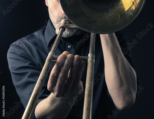 Playing trombone, close up shot