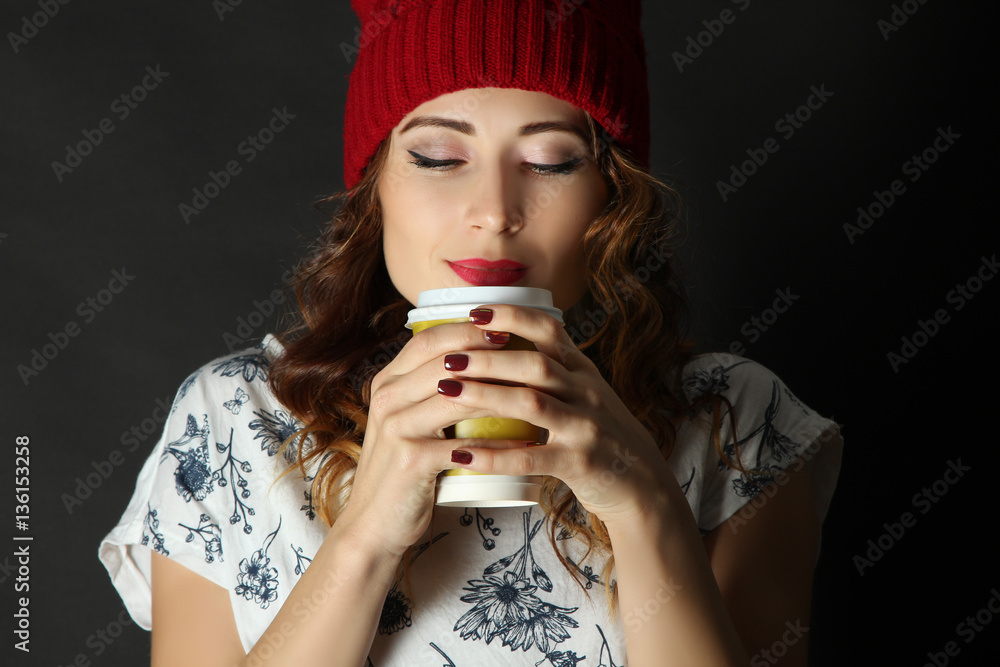 Beautiful girl enjoying the aroma of coffee.