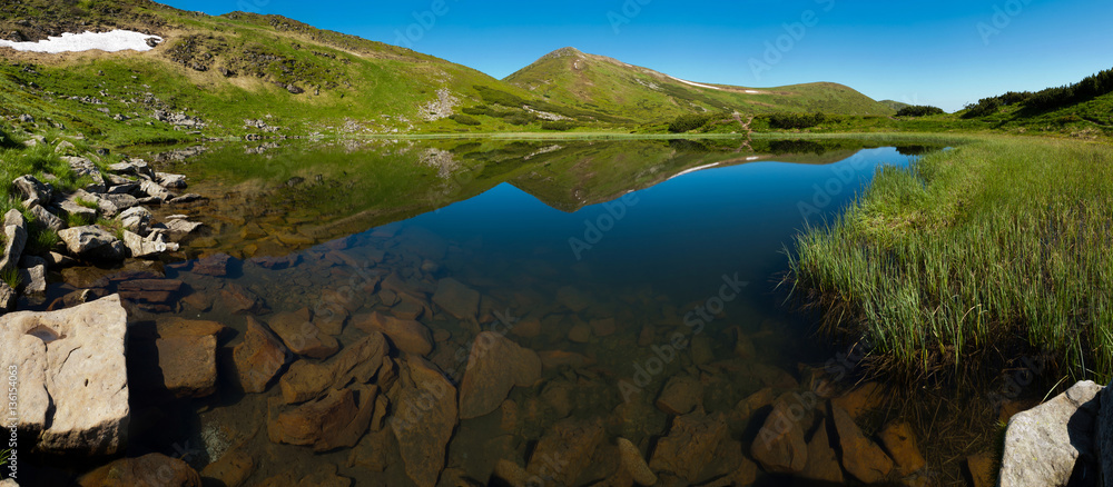 Mountain Lake on a clear summer day in the Carpathian mountains.