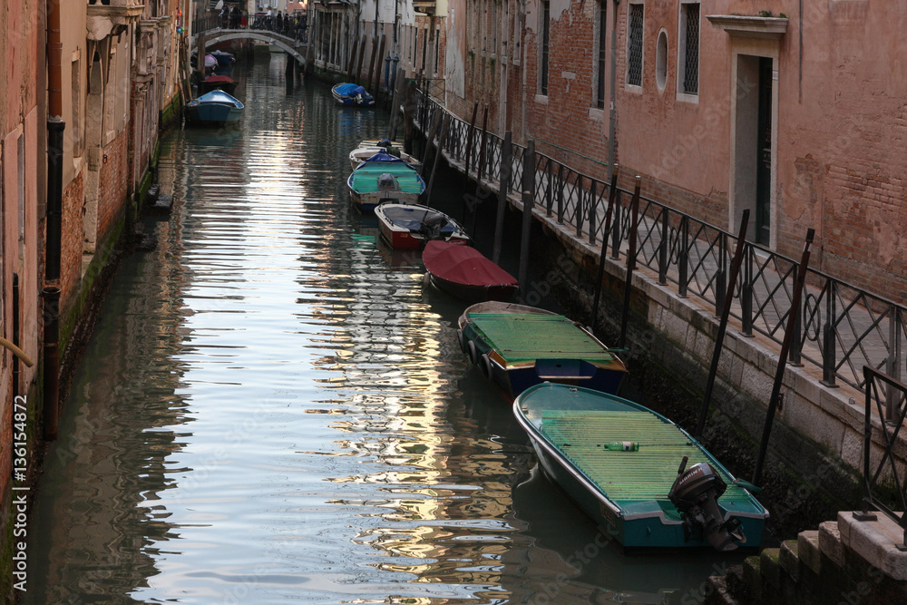 Boats on a canal in the old town of Venice, Italy