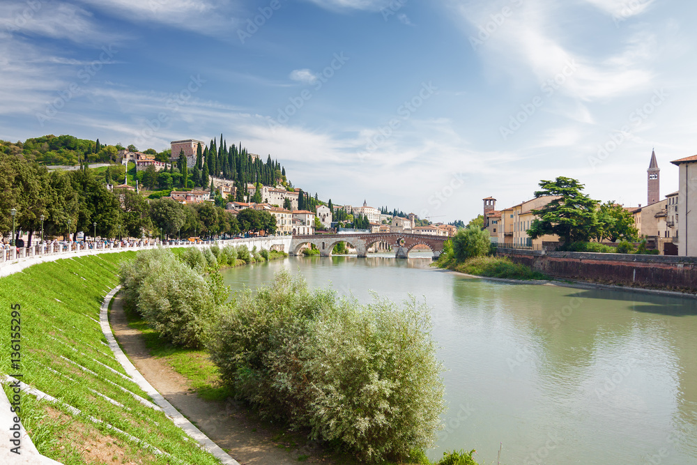 Sunny view of Adige river and Stone Bridge (Ponte di Pietra) in Verona, Veneto region, Italy. Sunny view of Adige river and Stone Bridge (Ponte di Pietra) in Verona, Veneto region, Italy.