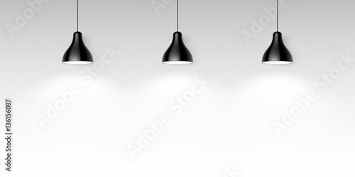 Three black hanging ceiling lamps