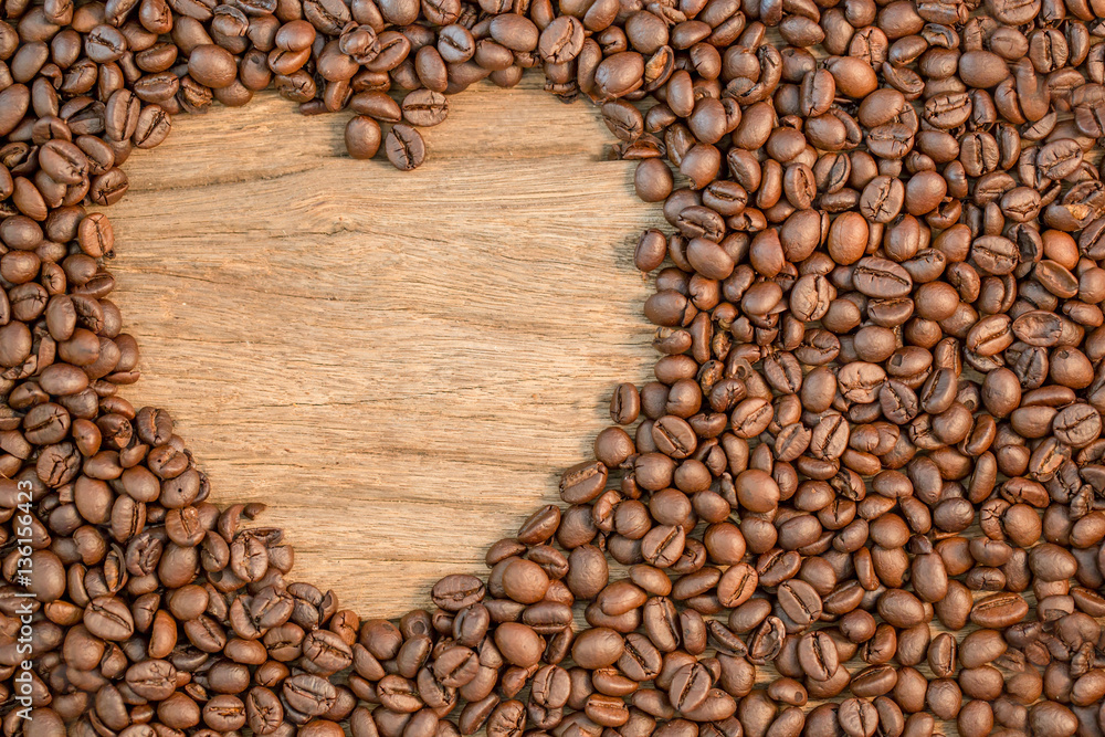 heart shape of coffee bean on wooden,top view heart shape of coffee bean on wooden,top view