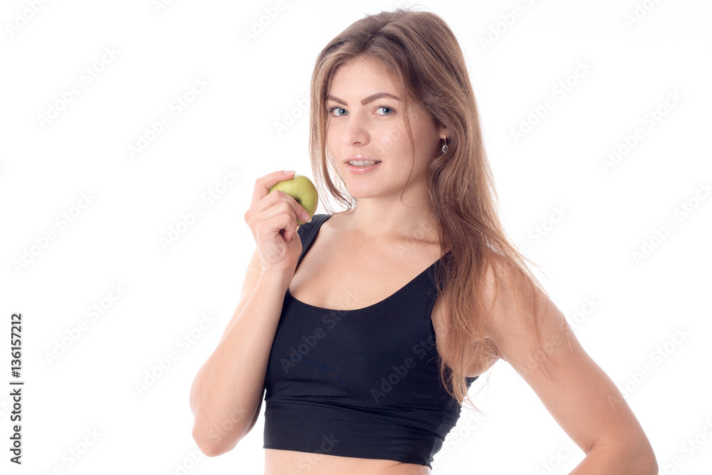 beautiful girl holding an apple in his hand and smiling beautiful girl holding an apple in his hand and smiling