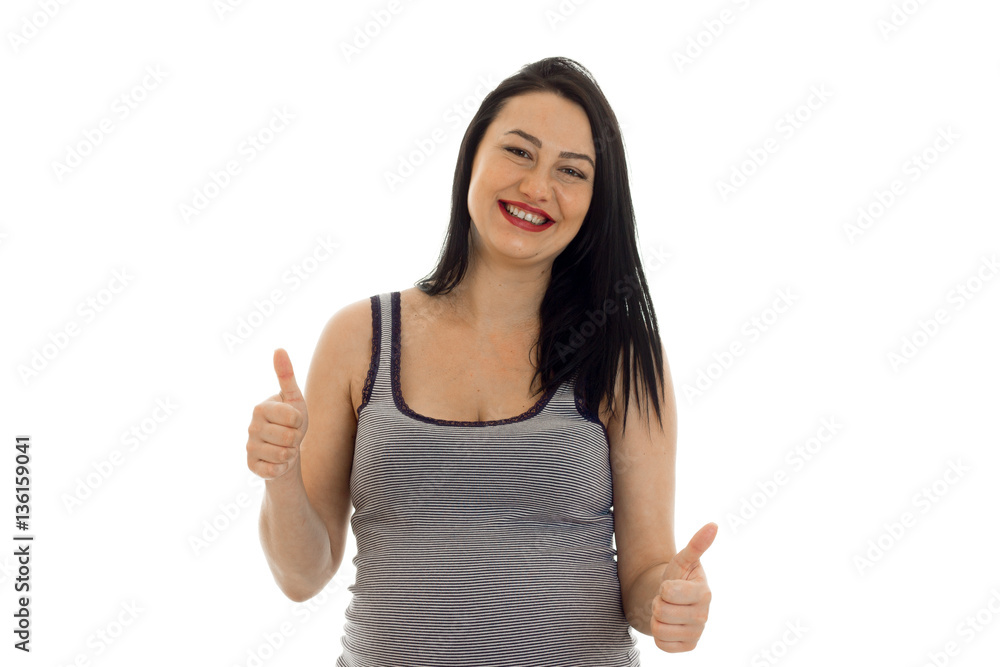 Young cheerful pregnant mother showing thumbs up isolated on white background in studio Young cheerful pregnant mother showing thumbs up isolated on white background in studio
