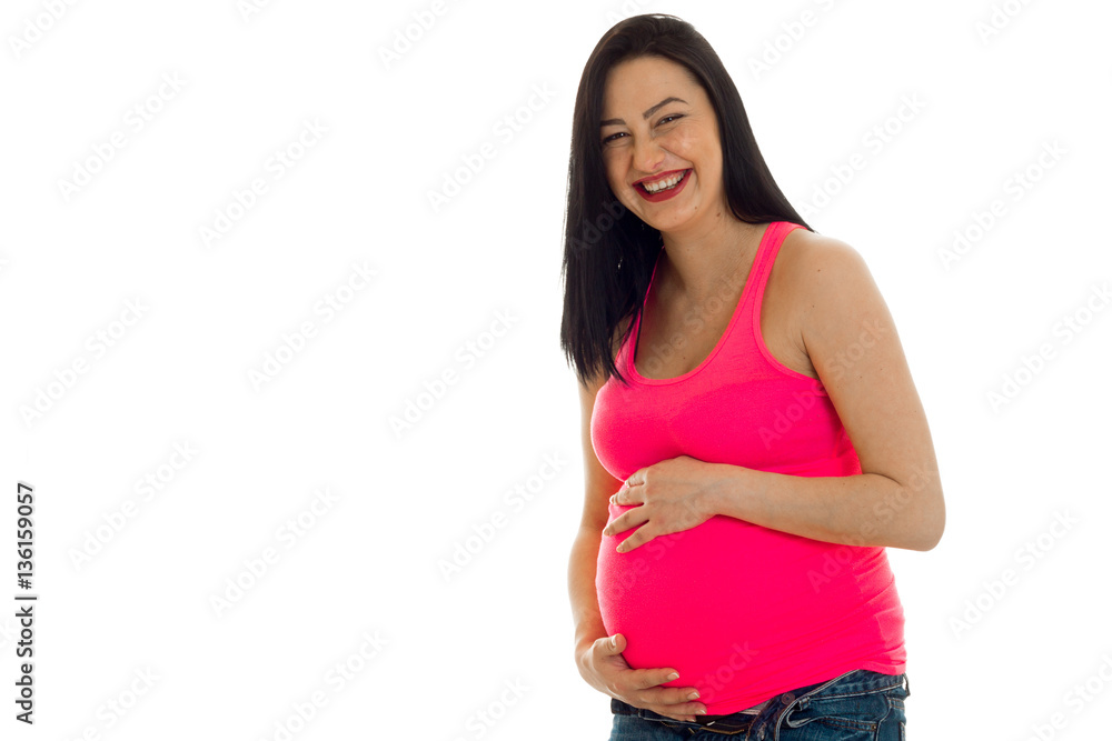 Young cheerful pregnant mother laughing isolated on white background in studio Young cheerful pregnant mother laughing isolated on white background in studio
