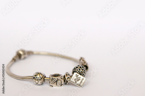 Obraz na płótnie Silver beads and charms isolated