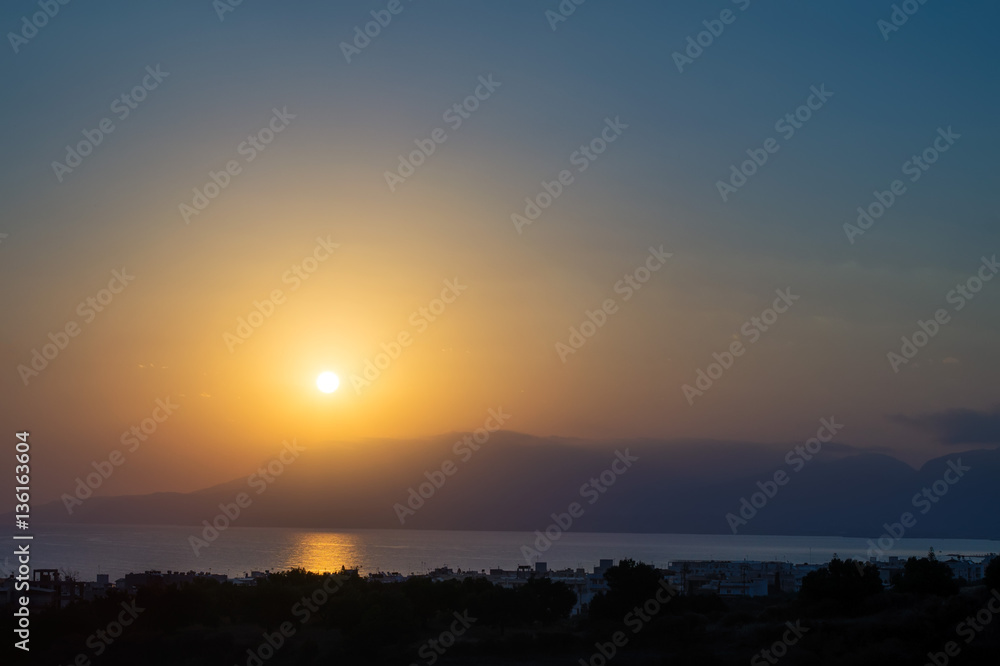 Hersonissos foggy sunrise with sun glade, Crete, Greece. Hersonissos foggy sunrise with sun glade, Crete, Greece.