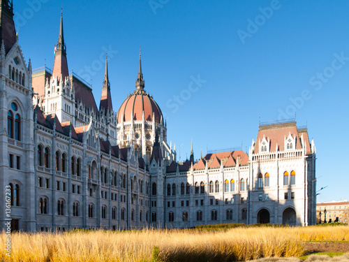 Daytime view of historical building of Hungarian Parliament, aka Orszaghaz, with typical central dome in Budapest, Hungary, Europe. It is notable landmark and seat of the National Assembly of Hungary