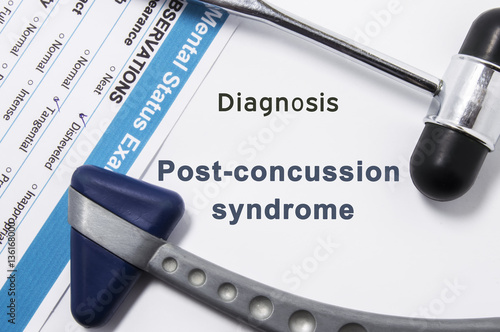 Diagnosis of Post-Concussion Syndrome. Two neurological hammer, result of mental status exam and name of neurologic psychiatric diagnosis Post-Concussion Syndrome on white background or doctor table photo