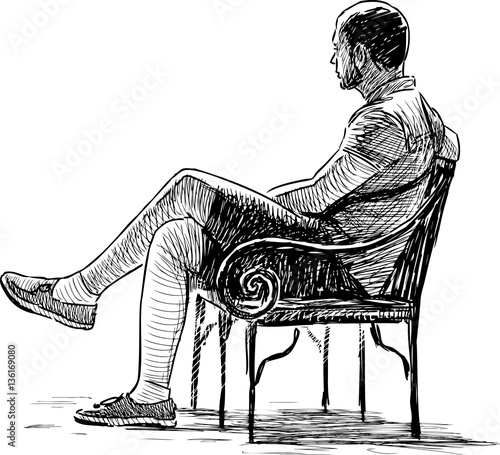 person relaxing on a park bench